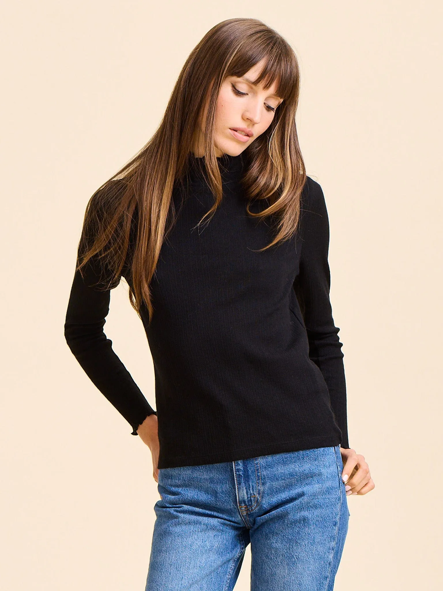 Carmela Pointelle Turtleneck in Black Overlock Edging ReflectiveTrimDetails